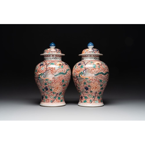 312 - A pair of Chinese famille verte 'phoenix' vases and covers, 19th C.H.: 44,5 cm (incl. cover)H.: 35 c... 