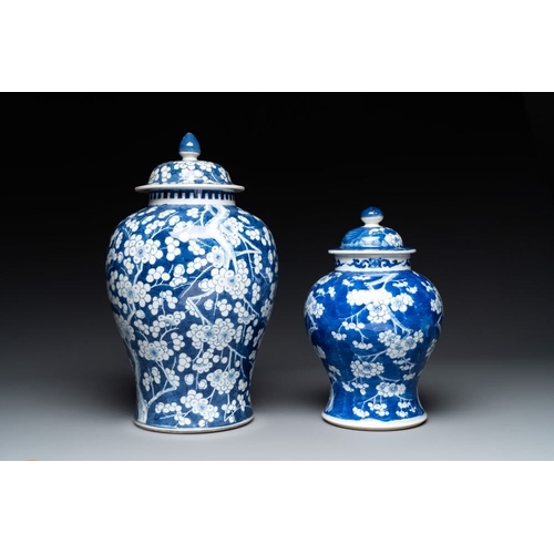 315 - Two Chinese blue and white 'prunus on cracked ice' vases and covers, Kangxi mark, 19th C.H.: 42 cm (... 