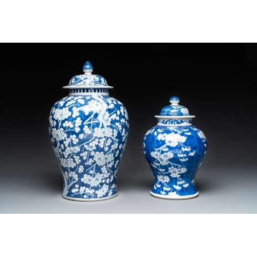 315 - Two Chinese blue and white 'prunus on cracked ice' vases and covers, Kangxi mark, 19th C.H.: 42 cm (... 