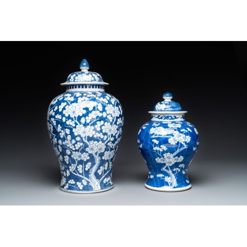 315 - Two Chinese blue and white 'prunus on cracked ice' vases and covers, Kangxi mark, 19th C.H.: 42 cm (... 