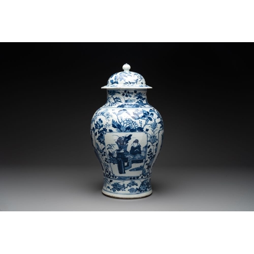 316 - A pair of Chinese blue and white vases and covers with figural panels, 19th C.H.: 50 cm (incl. cover... 