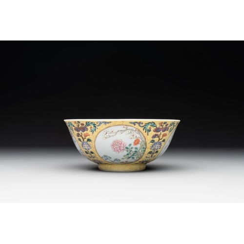 334 - A Chinese blue, white and famille rose bowl with floral design, Qianlong mark, 19/20th C.Dia.: 15 cm... 