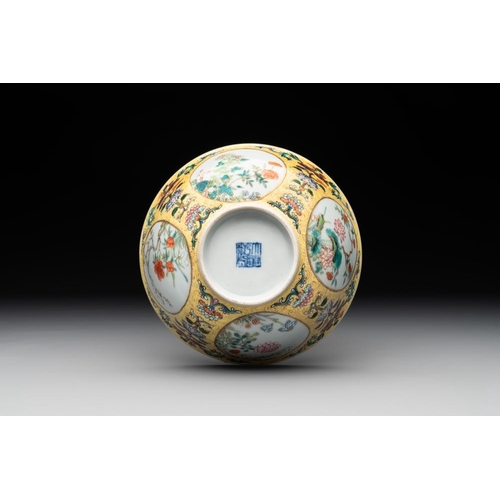 334 - A Chinese blue, white and famille rose bowl with floral design, Qianlong mark, 19/20th C.Dia.: 15 cm... 