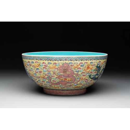 337 - A Chinese famille rose turquoise-and-yellow-ground 'dragon' bowl on wooden stand, Qianlong mark, Rep... 