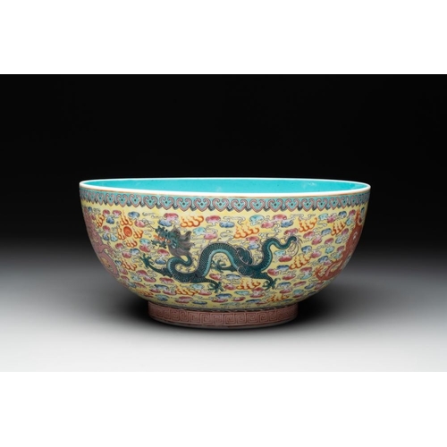 337 - A Chinese famille rose turquoise-and-yellow-ground 'dragon' bowl on wooden stand, Qianlong mark, Rep... 