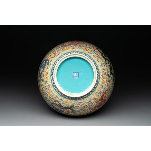 337 - A Chinese famille rose turquoise-and-yellow-ground 'dragon' bowl on wooden stand, Qianlong mark, Rep... 