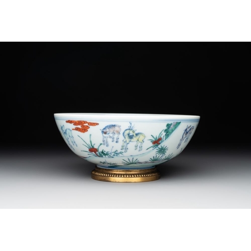 34 - A Chinese doucai 'deer' bowl with gilt bronze stand, Chenghua mark, 18th C.Dia.: 19,5 cm - H.: 8,5 c... 