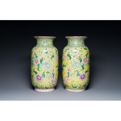 386 - A pair of Chinese famille rose yellow-ground 'dragon' vases, Qianlong mark, RepublicH.: 42,5 cm... 