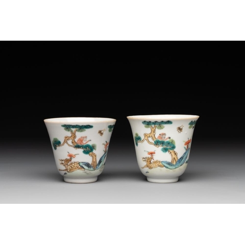 395 - A pair of Chinese famille rose 'monkey and deer' cups and saucers, Tongzhi mark and of the periodDia... 