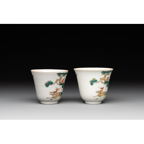 395 - A pair of Chinese famille rose 'monkey and deer' cups and saucers, Tongzhi mark and of the periodDia... 