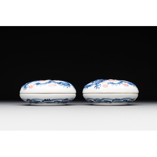 427 - A pair of Chinese blue and white and a pair of blue, white and copper-red seal paste boxes, Kangxi a... 