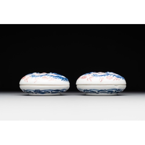 427 - A pair of Chinese blue and white and a pair of blue, white and copper-red seal paste boxes, Kangxi a... 