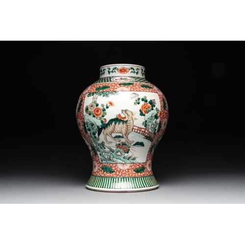 448 - A Chinese famille verte 'mythical animal' vase and two Canton famille rose vases, 19th C.H.: 35 cm (... 