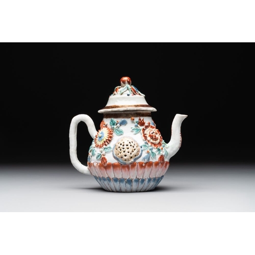 480 - A Chinese famille rose teapot and stand with floral relief design, QianlongDia.: 16,5 cm (the stand)... 