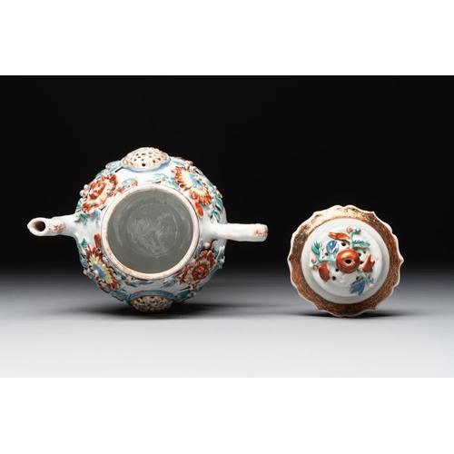 480 - A Chinese famille rose teapot and stand with floral relief design, QianlongDia.: 16,5 cm (the stand)... 