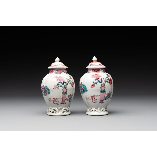 504 - A pair of Chinese famille rose 'antiquities' tea caddies and covers, Yongzheng/QianlongH.: 12 cm (in... 