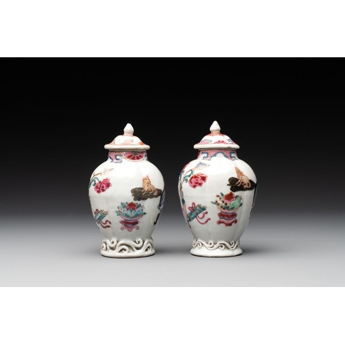 504 - A pair of Chinese famille rose 'antiquities' tea caddies and covers, Yongzheng/QianlongH.: 12 cm (in... 