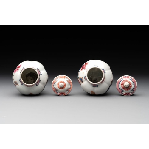 504 - A pair of Chinese famille rose 'antiquities' tea caddies and covers, Yongzheng/QianlongH.: 12 cm (in... 