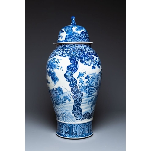 534 - A massive Japanese blue and white Arita vase and cover with an eagle, a shishi and cub, 19th C.H.: 1... 