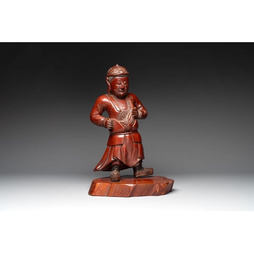 543 - A Japanese lacquered wooden figure of a guardian, 19th C.H.: 46,5 cm (incl. stand)... 