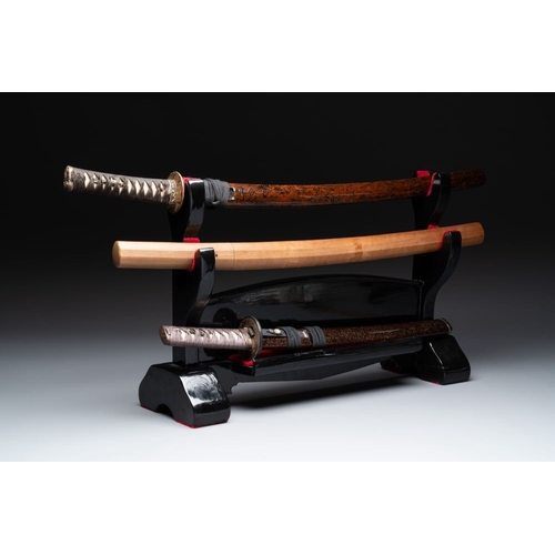 545 - A collection of fine Japanese sword handles, guards, sheaths, a sword and a lacquered stand, Edo, 18... 