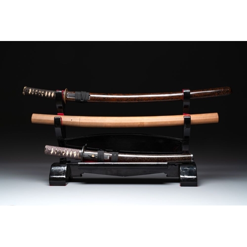 545 - A collection of fine Japanese sword handles, guards, sheaths, a sword and a lacquered stand, Edo, 18... 