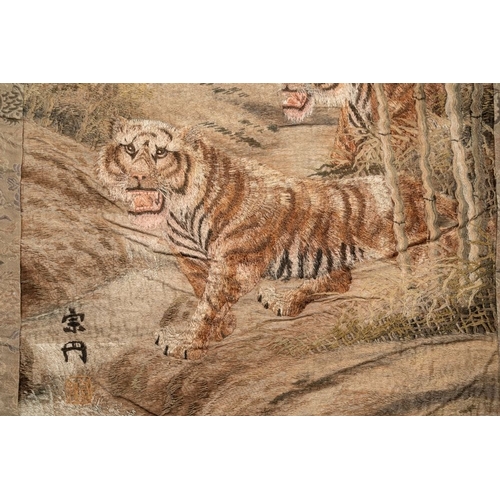 547 - A Japanese embroidered silk wall tapestry with two tigers, Meiji, 19th C.Dim.: 132,5 x87,5 cm... 