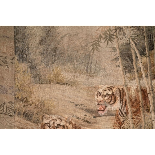 547 - A Japanese embroidered silk wall tapestry with two tigers, Meiji, 19th C.Dim.: 132,5 x87,5 cm... 