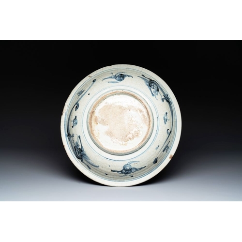 56 - A Chinese Swatow blue and white dish with stylised floral design, MingDia.: 40 cm... 