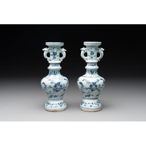 59 - A pair of Chinese blue and white handled vases with floral design, MingH.: 21 cm