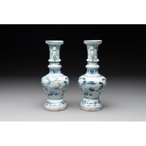 59 - A pair of Chinese blue and white handled vases with floral design, MingH.: 21 cm