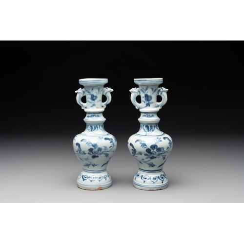 59 - A pair of Chinese blue and white handled vases with floral design, MingH.: 21 cm