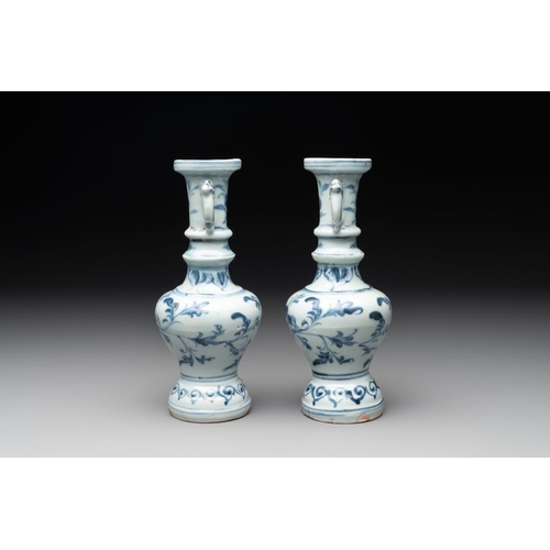 59 - A pair of Chinese blue and white handled vases with floral design, MingH.: 21 cm