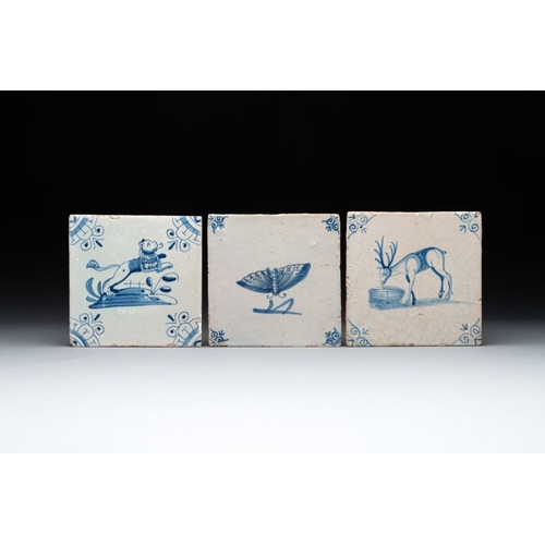 602 - Three blue and white Dutch Delft tiles with a lion, a butterfly and a deer, 17th C.Dim.: ca. 13 x 13... 