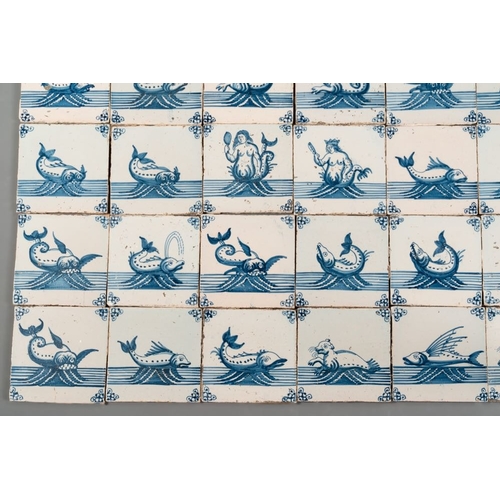 617 - A field of 30 Dutch Delft blue and white tiles with sea creatures and ships, 18th C.Dim.: 13 x 13 cm... 