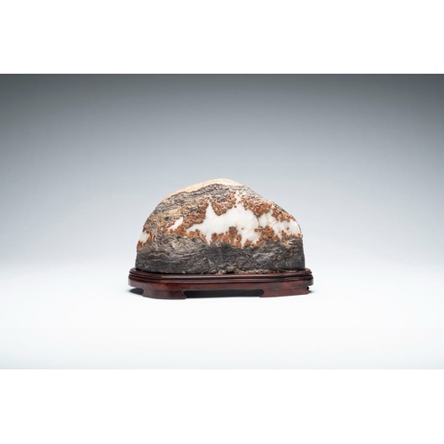 622 - A Chinese wucai Lingbi stone scholar's rock on wooden standDim.: 31 x 12 x22 cm (incl. stand)
Proven... 