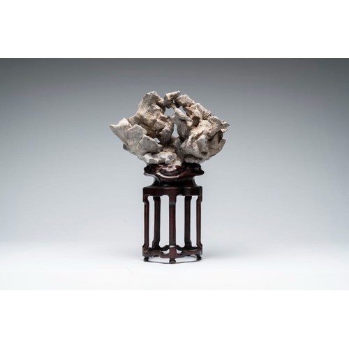 625 - A Chinese Taihu stone scholar's rock on wooden standH.: 44,5 cm (incl. stand)
Provenance: - From the... 