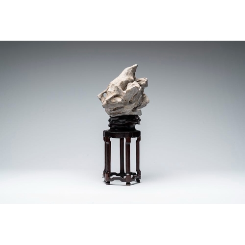 625 - A Chinese Taihu stone scholar's rock on wooden standH.: 44,5 cm (incl. stand)
Provenance: - From the... 