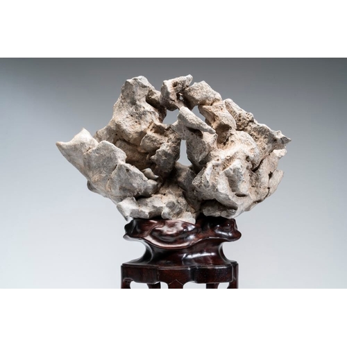 625 - A Chinese Taihu stone scholar's rock on wooden standH.: 44,5 cm (incl. stand)
Provenance: - From the... 