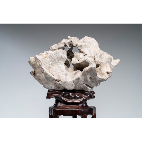 625 - A Chinese Taihu stone scholar's rock on wooden standH.: 44,5 cm (incl. stand)
Provenance: - From the... 