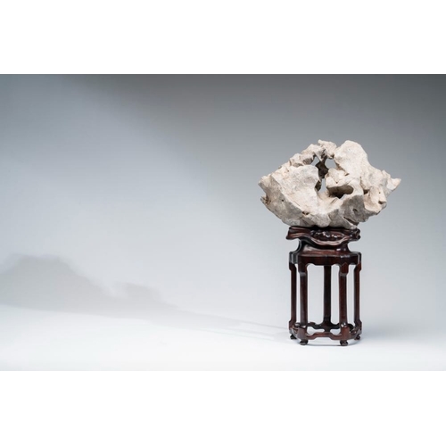 625 - A Chinese Taihu stone scholar's rock on wooden standH.: 44,5 cm (incl. stand)
Provenance: - From the... 