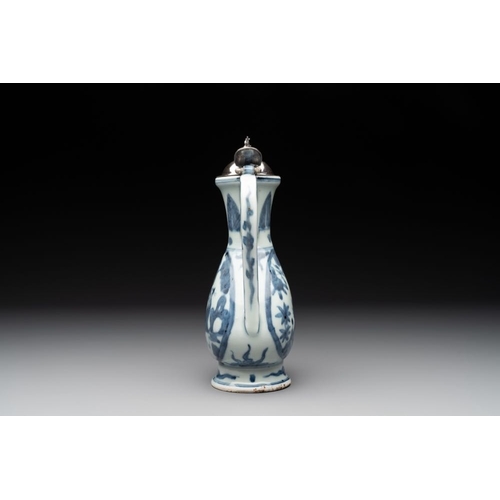 67 - A Chinese silver-mounted blue and white ewer with figures in a landscape, MingH.: 24,5 cm (incl. sil... 