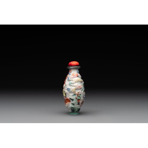 670 - A Chinese famille rose relief-molded snuff bottle with narrative design, Xianfeng mark and of the pe... 