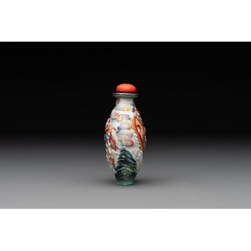 670 - A Chinese famille rose relief-molded snuff bottle with narrative design, Xianfeng mark and of the pe... 