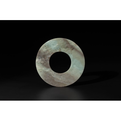 688 - A Chinese celadon and russet jade 'bi' disc, Neolithic periodDia.: 19 cm
Weight: 253 grams
Provenanc... 