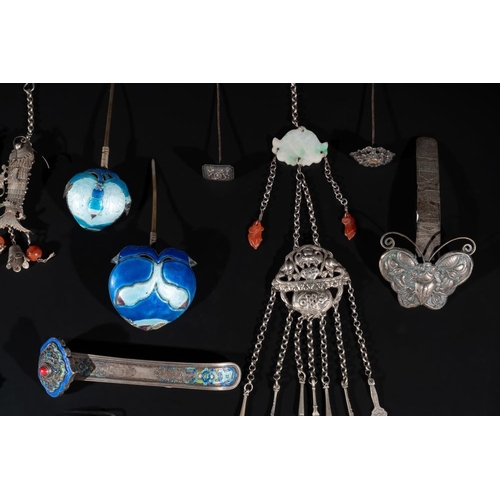 704 - A collection of Chinese silver jewellery, some pieces adorned with enamel and precious stones, 19/20... 