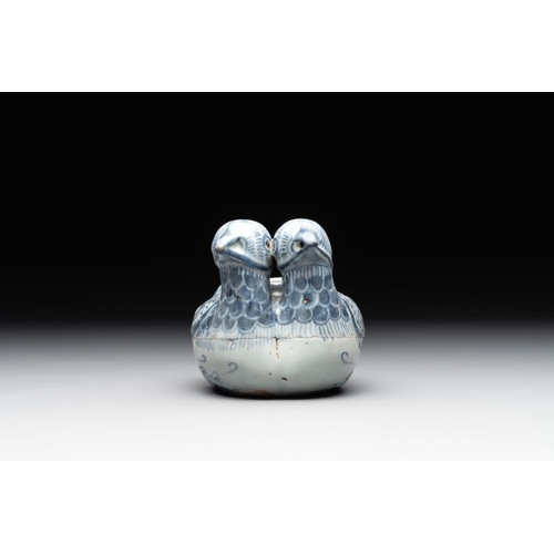 71 - A Chinese blue and white 'double mandarin duck' ewer or water dropper on wooden stand, Ming, ca. 150... 