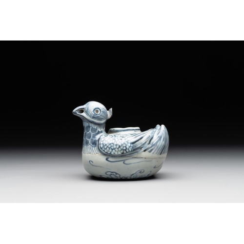 71 - A Chinese blue and white 'double mandarin duck' ewer or water dropper on wooden stand, Ming, ca. 150... 