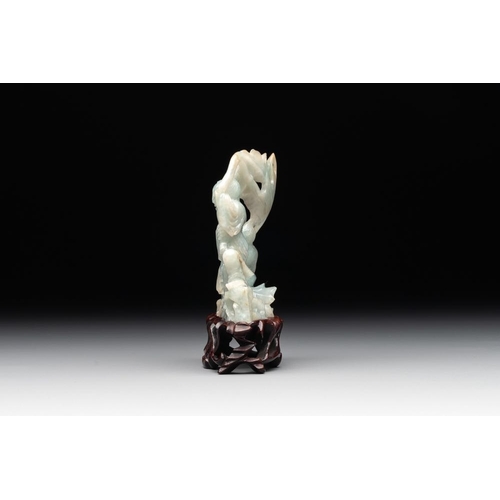 710 - A Chinese jade 'He He Er Xian' group on wooden stand, 19th C.H.: 9,5 cm (incl. stand)H.: 7,4 cm
Weig... 