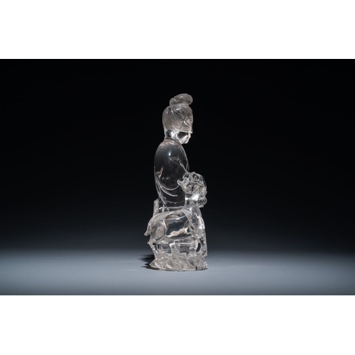 711 - A Chinese rock crystal sculpture of Lan Caihe on wooden stand, 19th C.H.: 32 cm (incl. stand)H.: 27 ... 